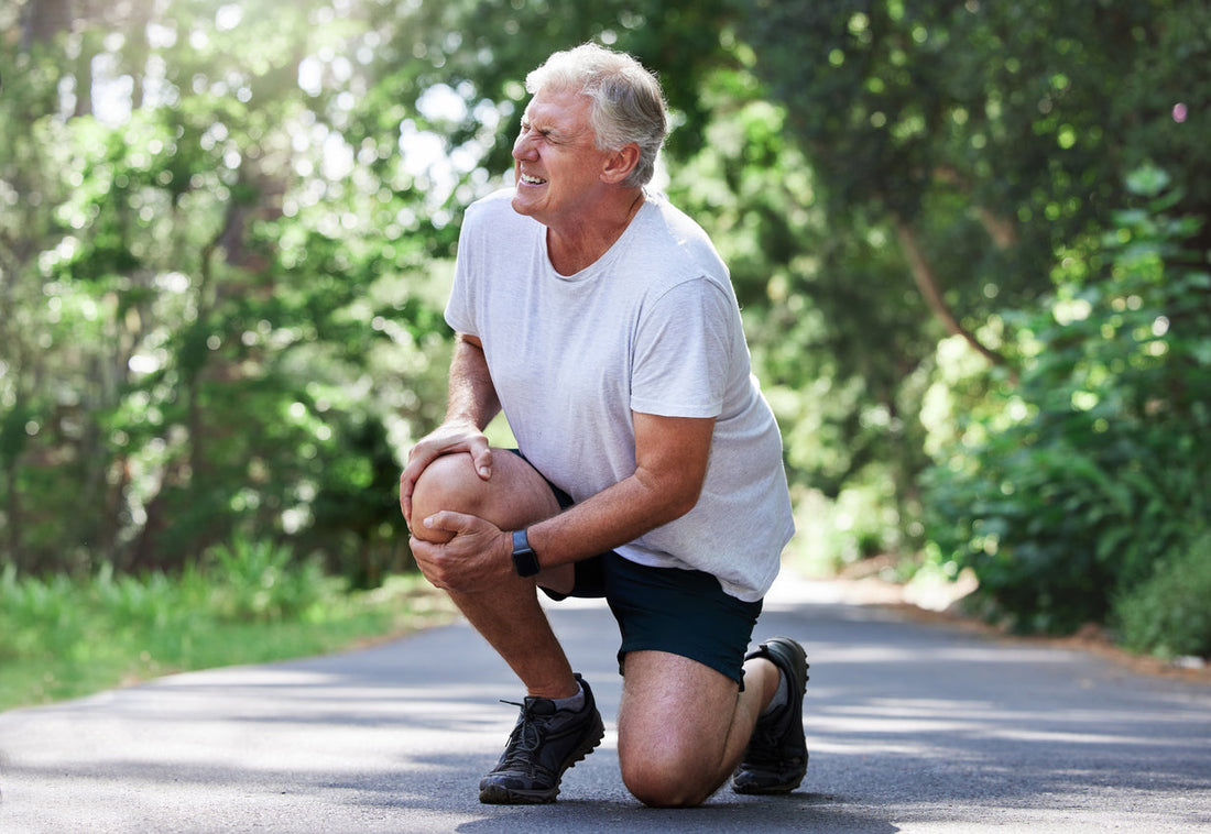 Man holding his knee in pain